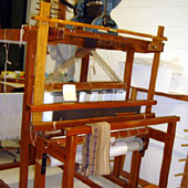 the shuttle going through the loom